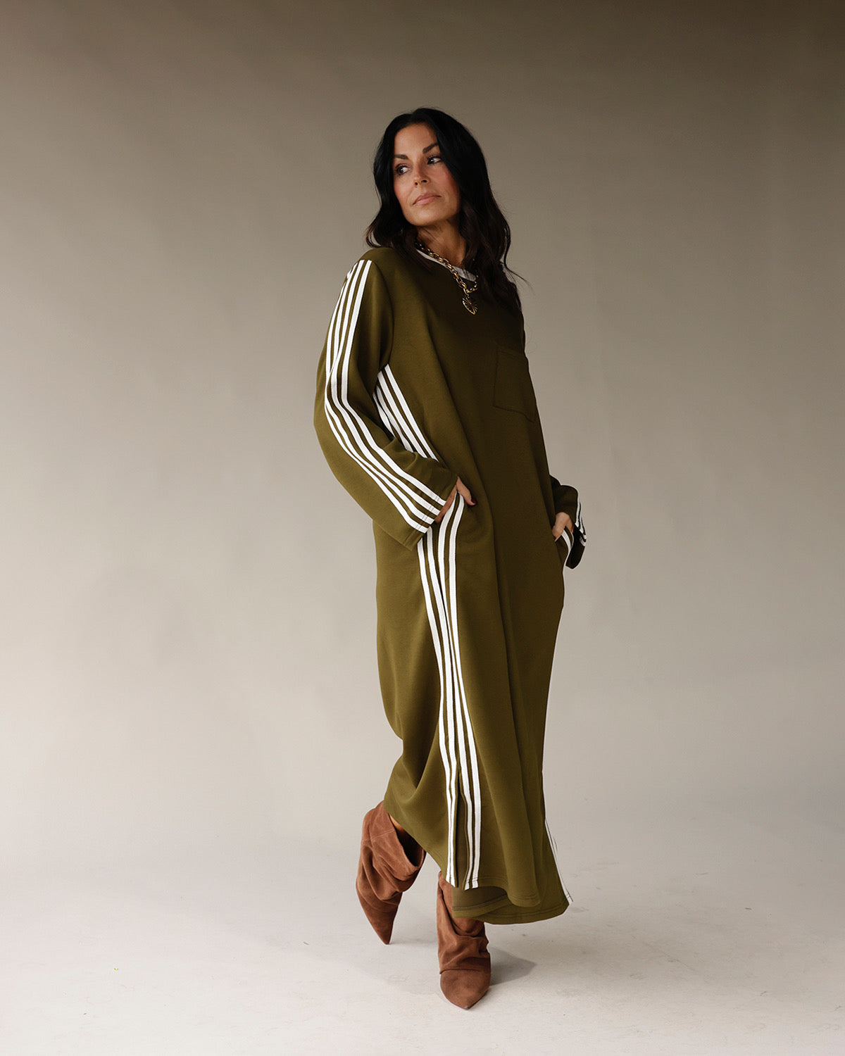 Olive green long sleeve maxi track dress with white side stripes and pockets