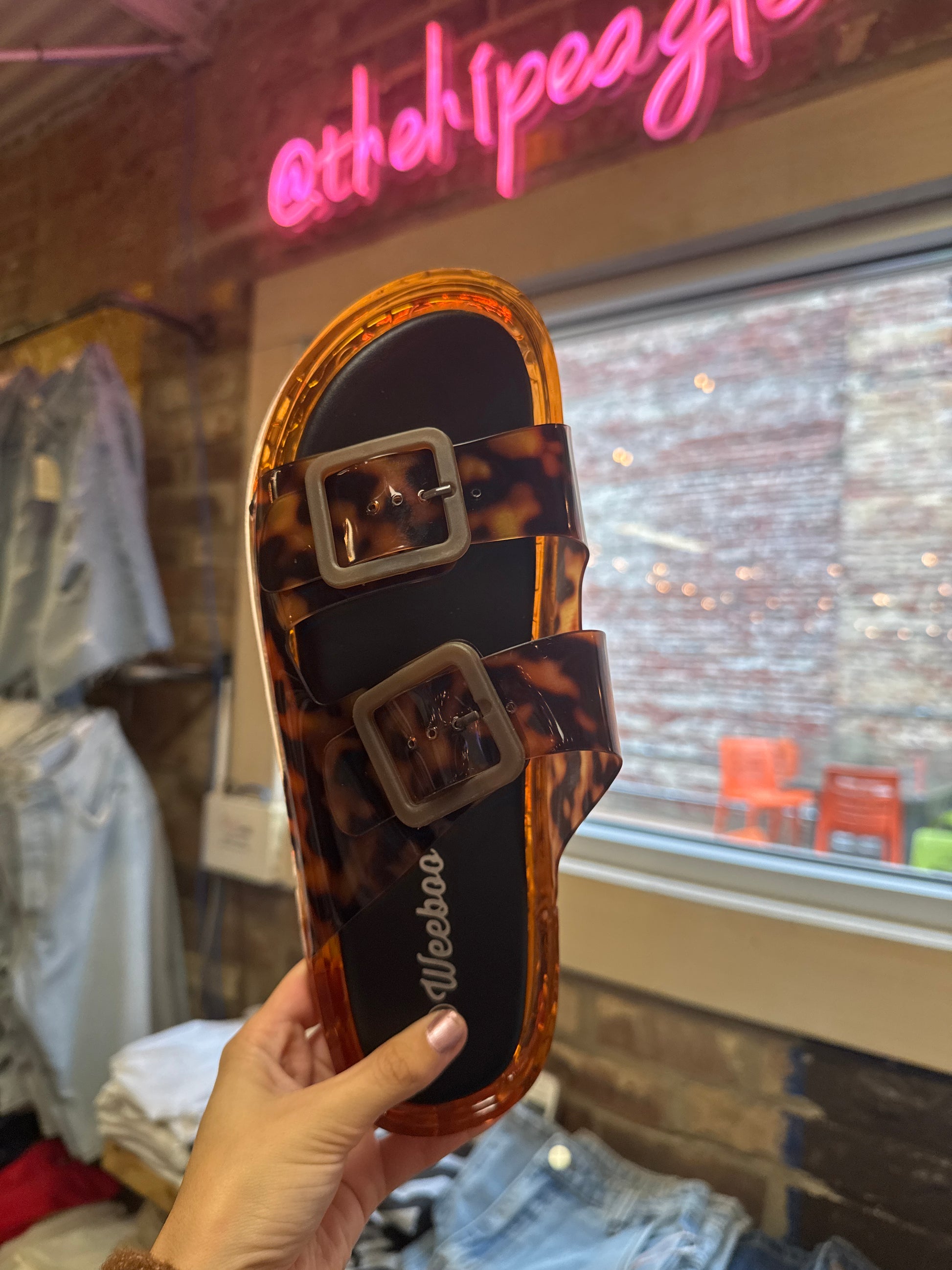 Tortoise shell double strap jelly slide sandal with buckles and amber platform sole
