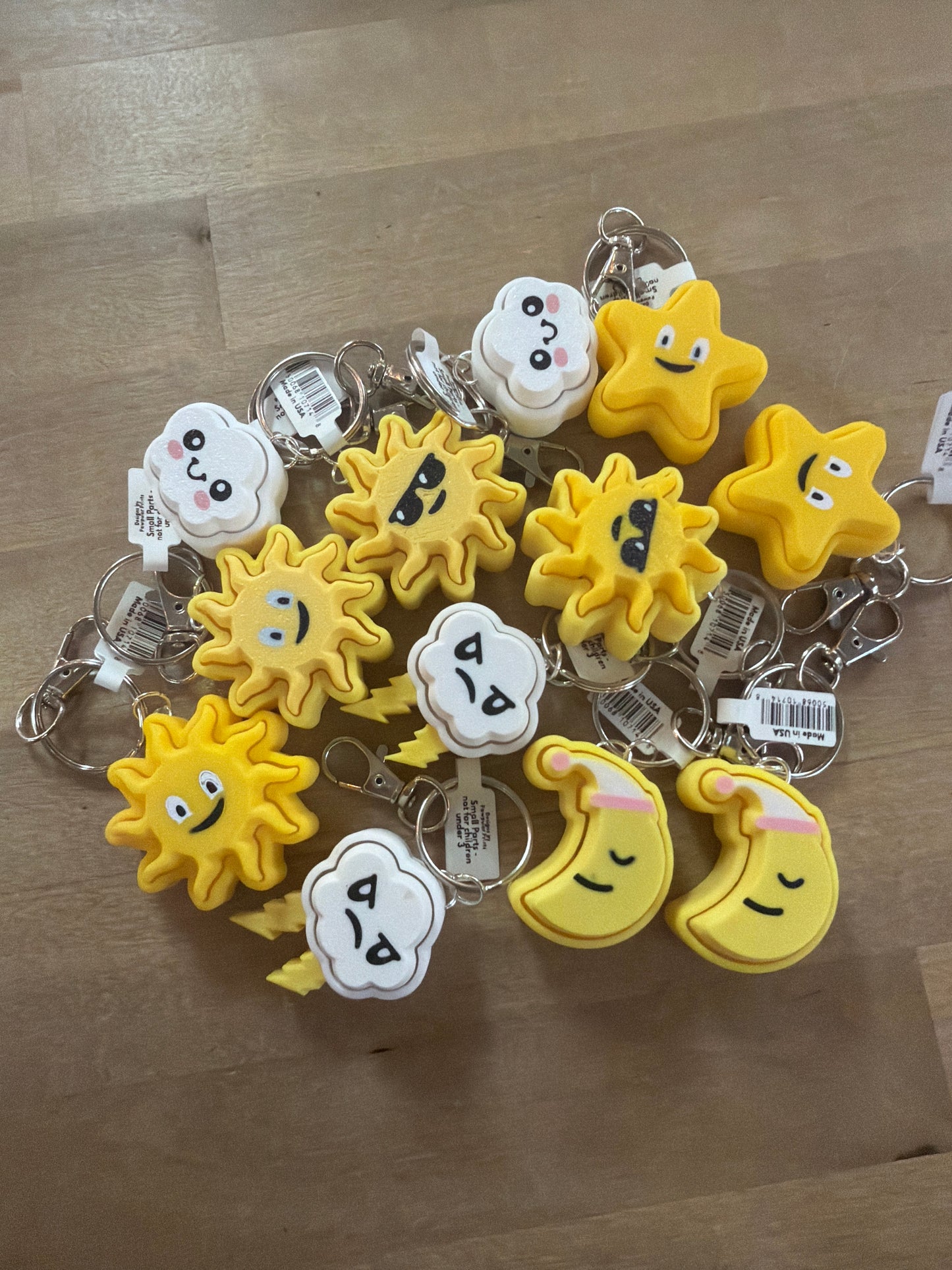 Yellow and white foam weather keychains: suns, stars, moons, and clouds with cute faces