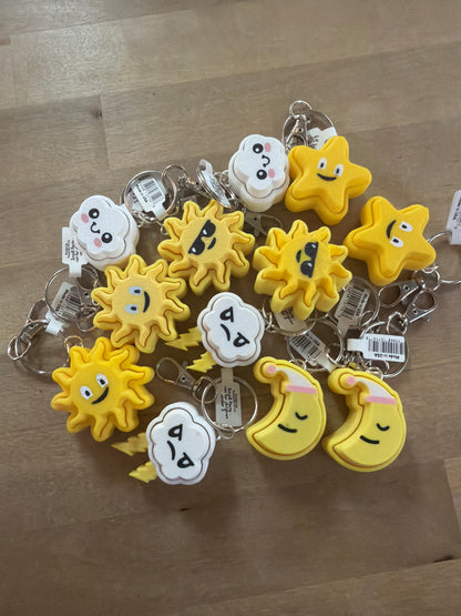 Yellow and white foam weather keychains: suns, stars, moons, and clouds with cute faces