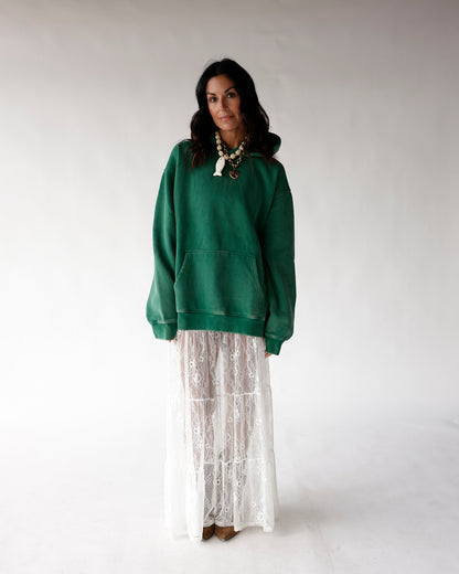 Oversized green hoodie with kangaroo pocket, styled with white lace maxi skirt