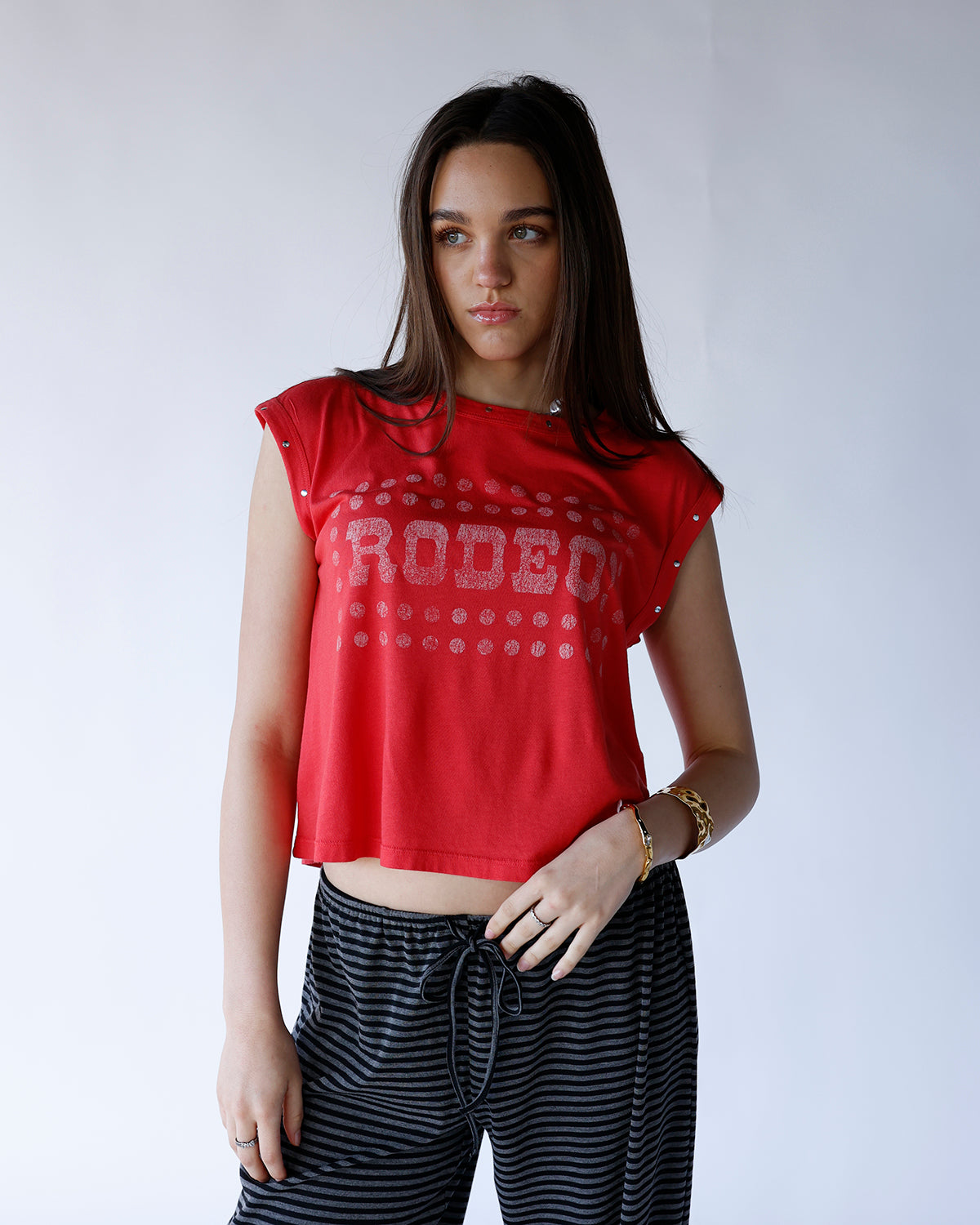 red graphic "rodeo" muscle tee with stud detailing on sleeve hems and neckline 