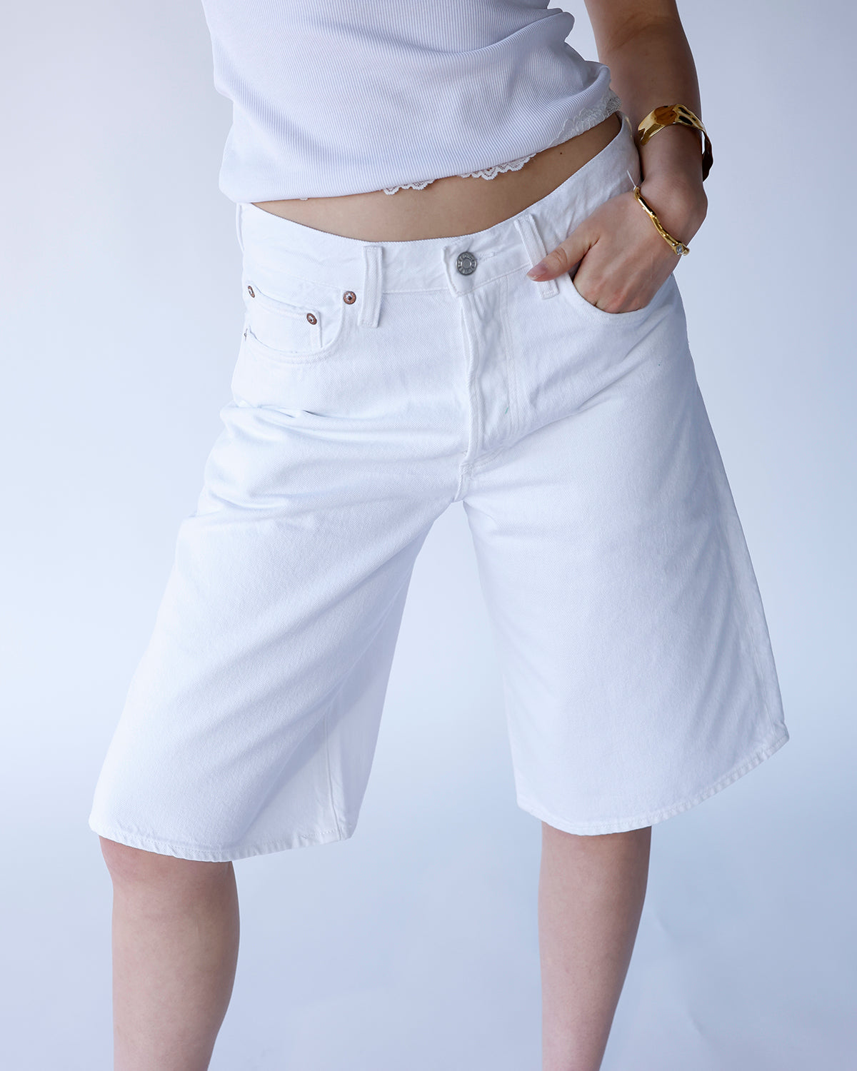 AGOLDE Ramona white denim long shorts with five-pocket styling and relaxed fit
