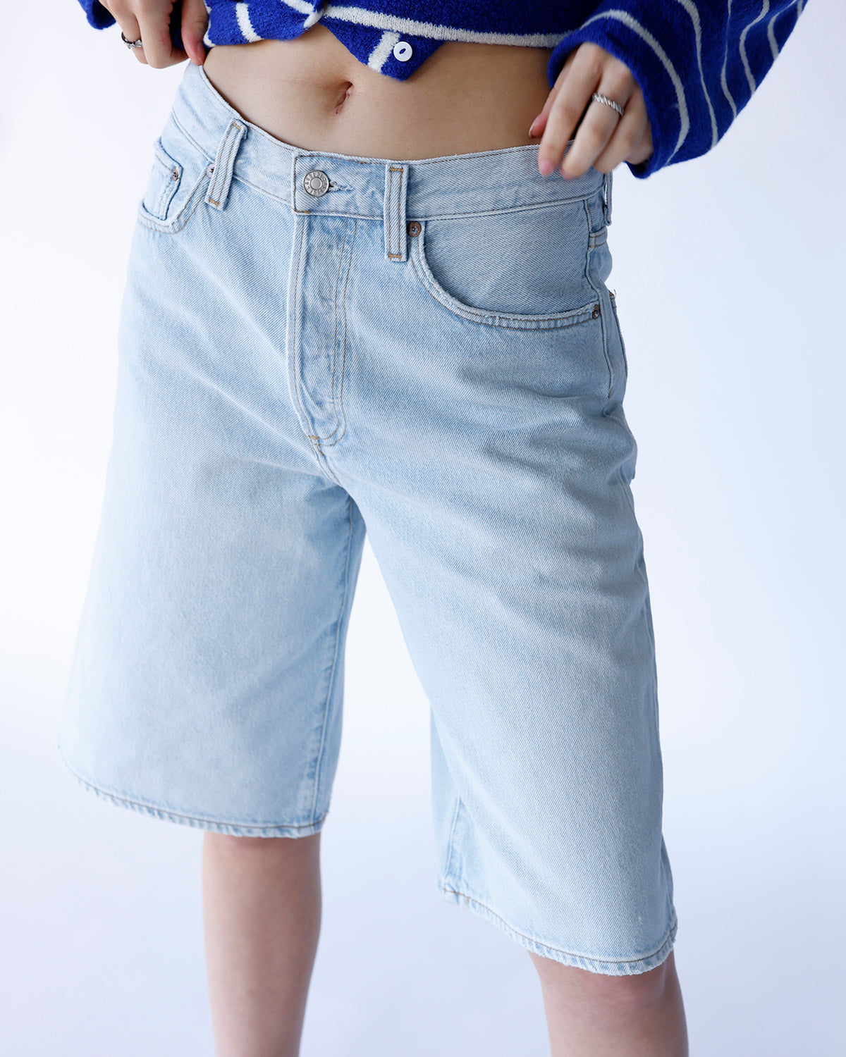 AGOLDE Ramona light wash blue denim bermuda shorts with classic five-pocket styling