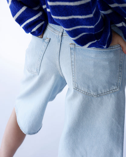 AGOLDE Ramona light wash denim shorts with back patch pockets, rear view