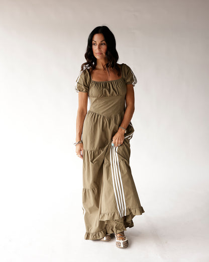 Olive green puff sleeve maxi dress with white stripe track details and ruffle hem