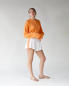 white terry shorts with orange track stripes 