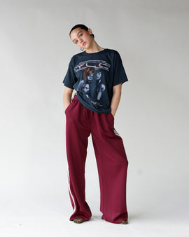 Oversized dark navy graphic band tee with trio portrait print, worn relaxed fit