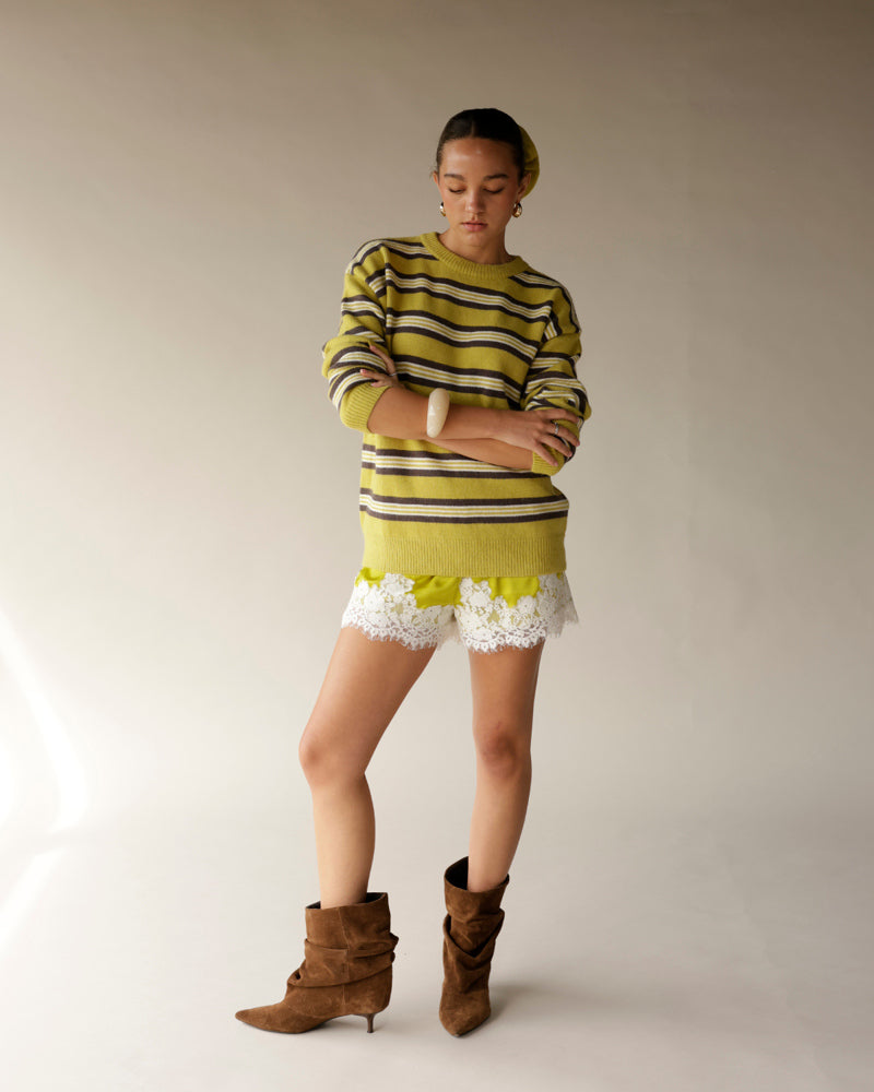 Lime green striped knit sweater with brown and white horizontal stripes