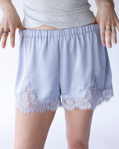 Baby blue satin shorts with floral lace trim hem and elastic waistband