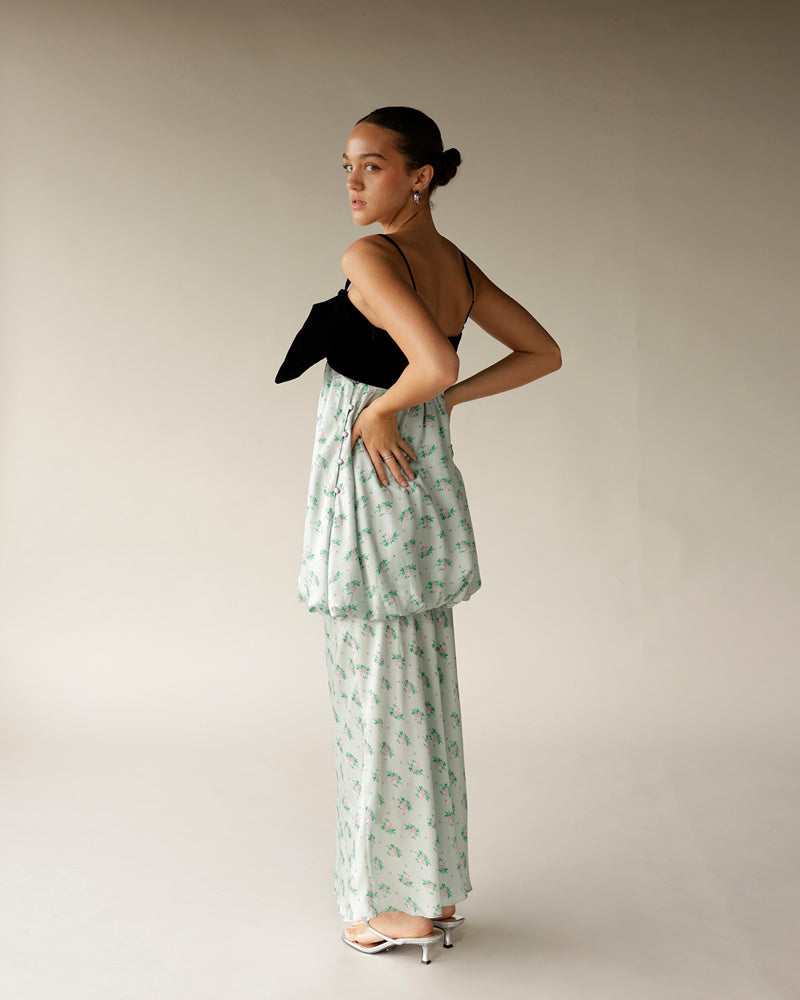 Mint green floral maxi dress with black velvet bow bodice and silver heels