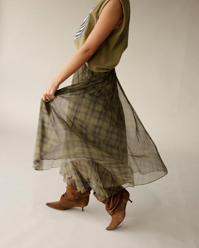 Olive green plaid organza maxi skirt with sheer overlay, worn with brown suede boots