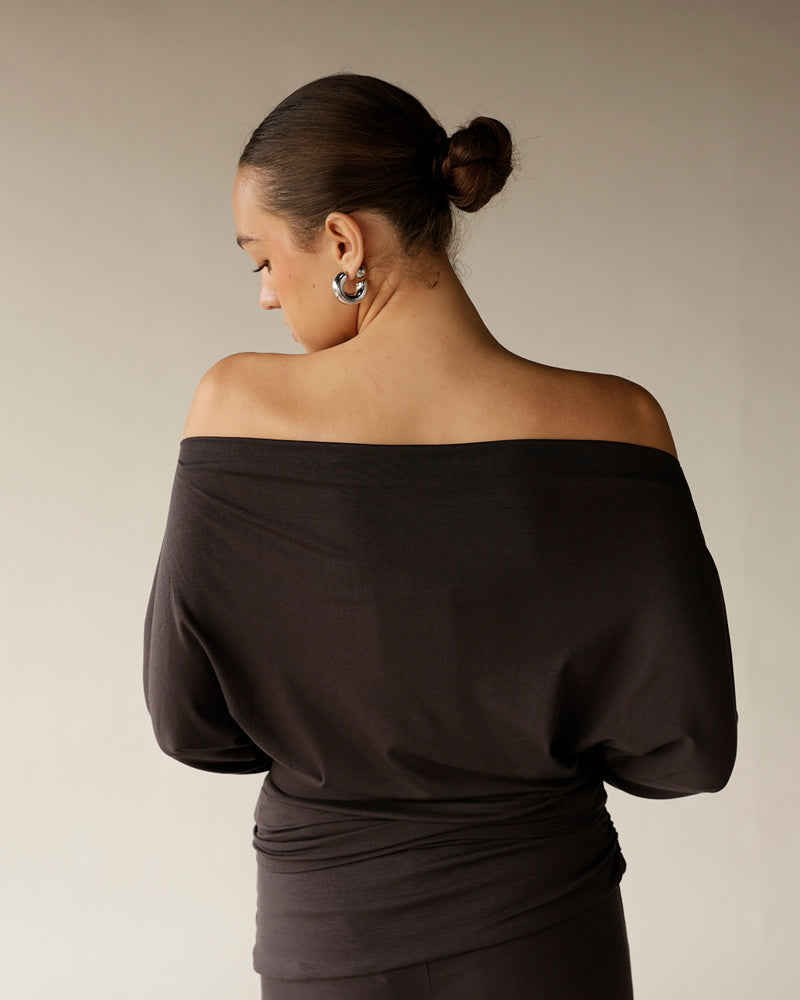 Women's dark brown off-shoulder top with ruched waist and long sleeves