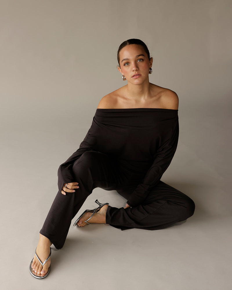 Black off-shoulder long-sleeve top with wide neckline fold detail