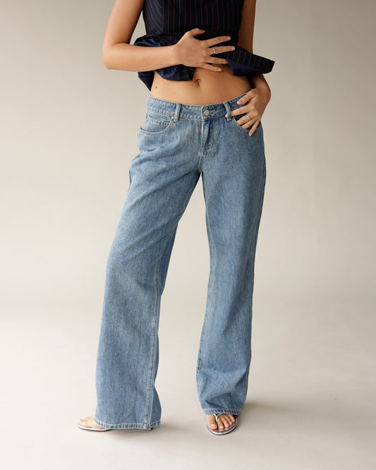 Women's low-rise wide-leg medium wash blue denim jeans with five-pocket styling