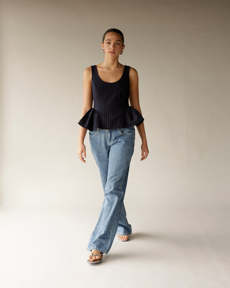 Women's light wash blue flare denim jeans with wide leg silhouette