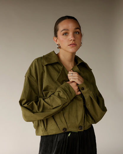 Women's olive green suede cropped button-up jacket with spread collar and long sleeves