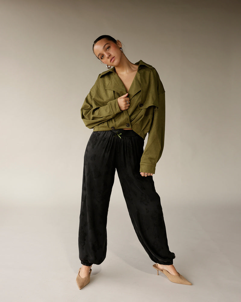 Women's olive green cropped trench jacket with button front and wide lapels