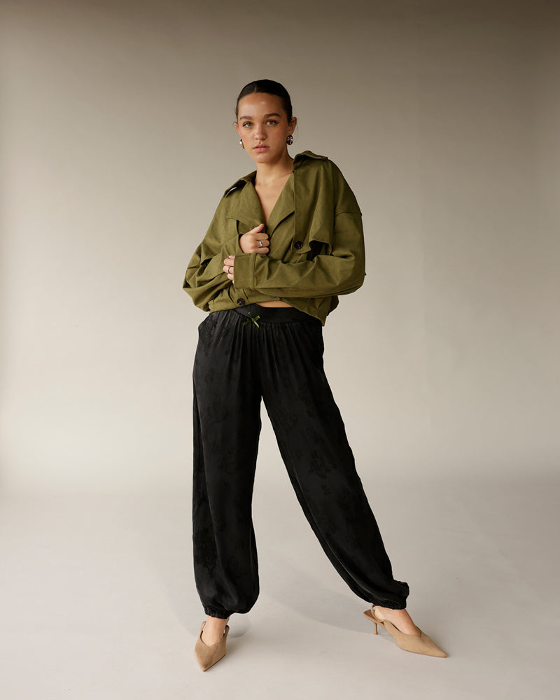 Women's olive green cropped trench jacket with lapels and button details