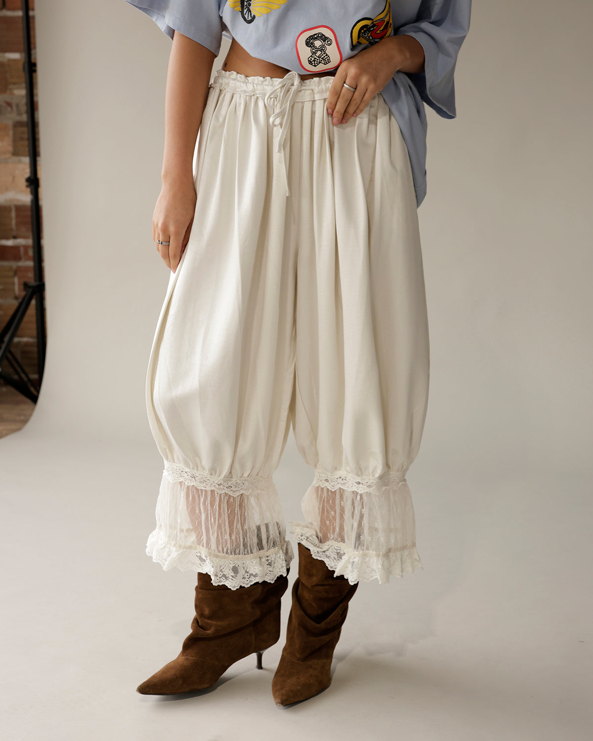 Ivory satin balloon pants with lace trim hem and drawstring waist