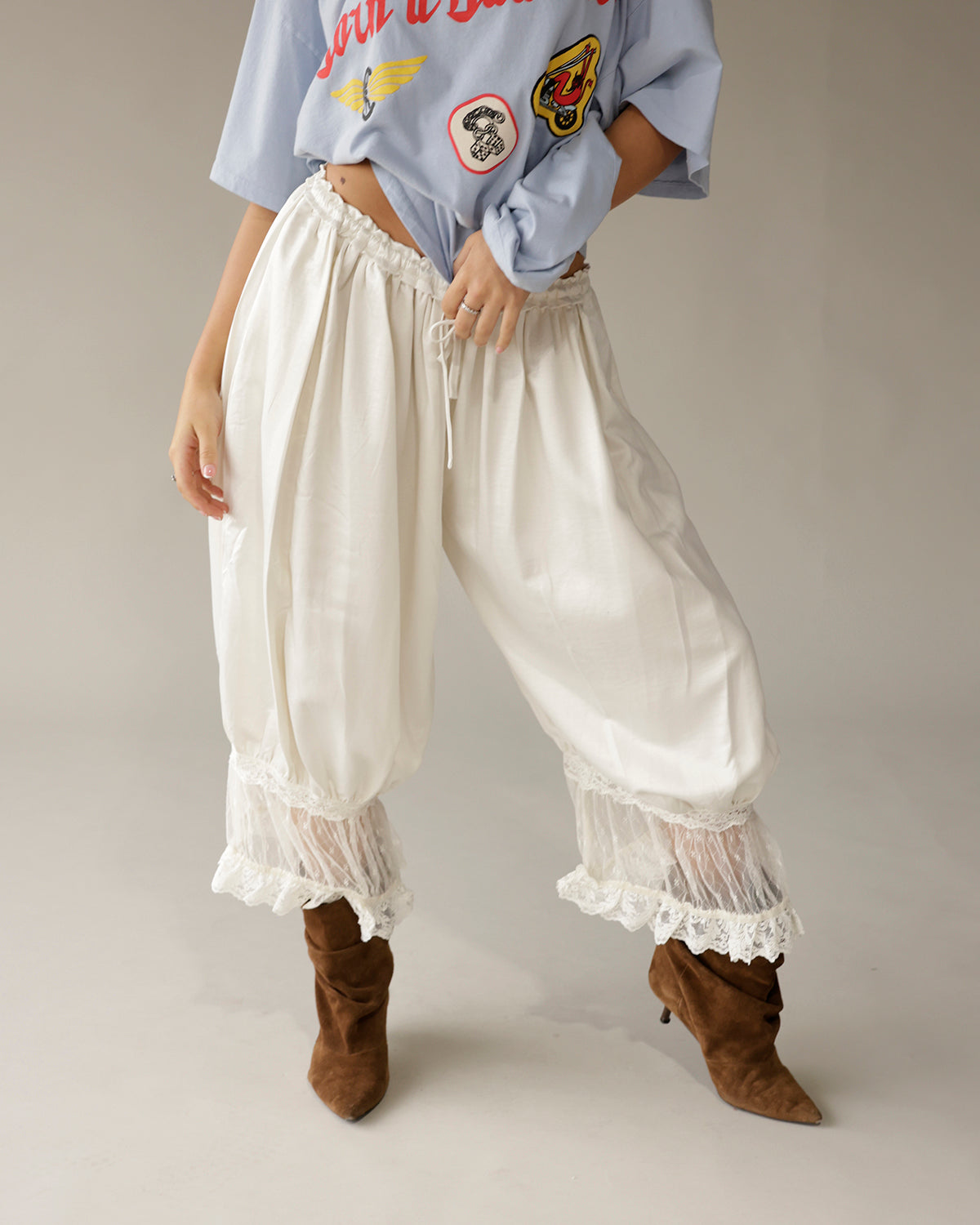 Cream satin balloon pants with lace trim hem and drawstring waist