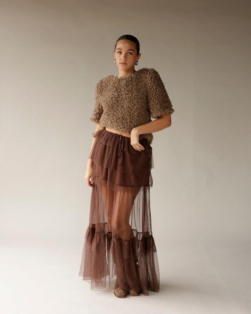 Cropped brown textured fuzzy sweater with short sleeves, paired with sheer tulle skirt