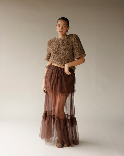 Cropped brown textured fuzzy sweater with short sleeves, paired with sheer tulle skirt