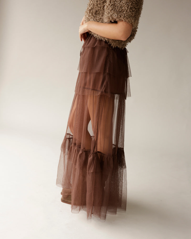 Brown tiered sheer tulle maxi skirt paired with textured brown fuzzy sweater top
