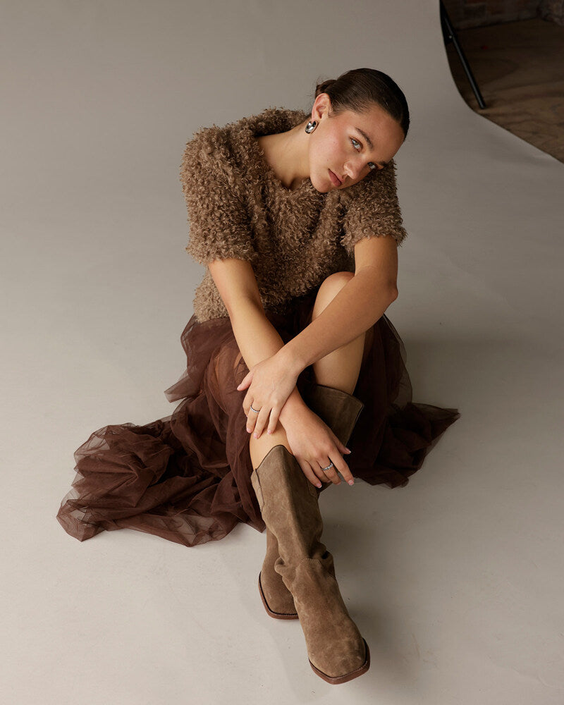 Brown curly textured knit sweater worn with chocolate tulle skirt and suede boots
