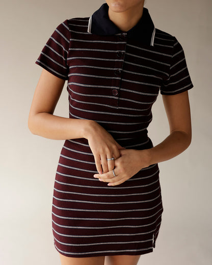 Burgundy striped polo mini dress with navy collar, buttons, and short sleeves