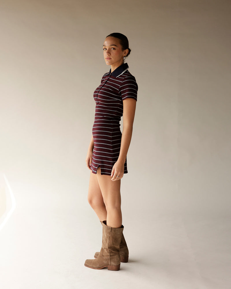 Burgundy striped polo mini dress with black collar and tan suede ankle boots