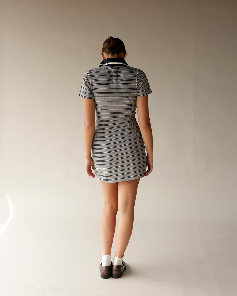 Gray striped polo mini dress with black collar, short sleeves, worn with loafers