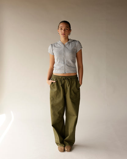 Olive green wide-leg cargo barrel pants with elastic drawstring waist and side pockets