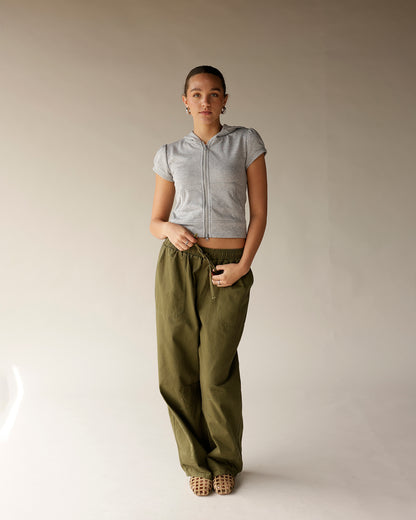 Olive green cargo barrel pants with elastic waistband and drawstring, wide leg fit