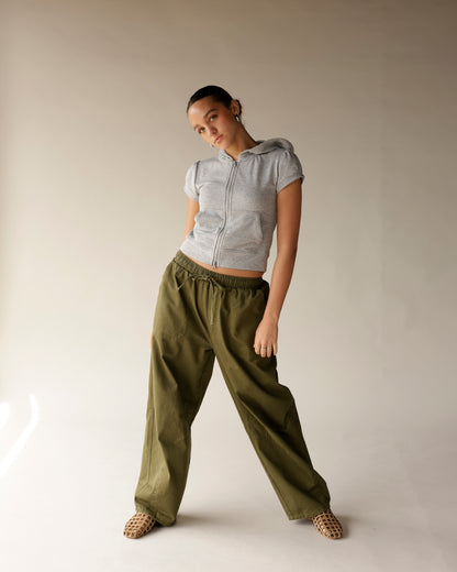 Olive green cargo barrel pants with elastic drawstring waist and wide leg fit