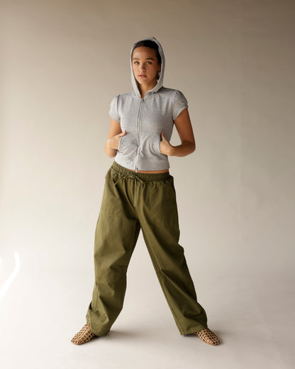 Olive green wide-leg cargo barrel pants with drawstring waist and side pockets