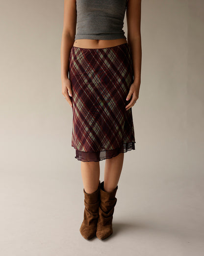 Gray ribbed tank top styled with burgundy plaid midi skirt and brown suede boots