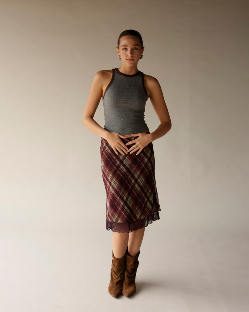 Gray ribbed sleeveless tank top with brown contrast trim, worn with plaid skirt