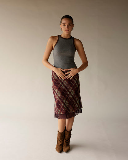 Gray ribbed sleeveless tank top with brown contrast trim, worn with plaid skirt