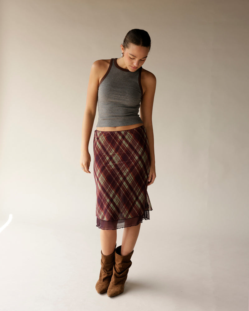 Gray ribbed racerback tank top with brown trim, styled with plaid skirt and boots