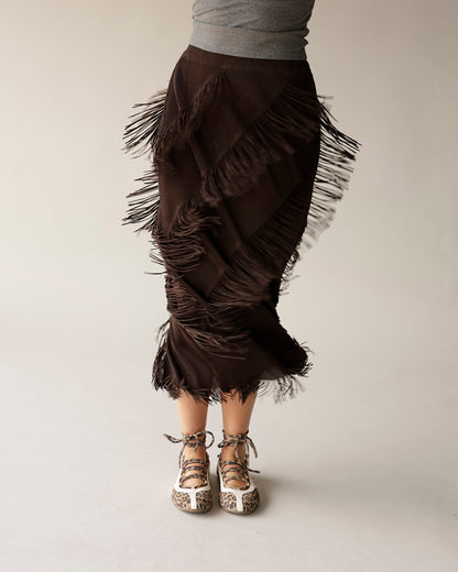 Dark brown midi fringe skirt with layered fringe detail, worn with leopard flats