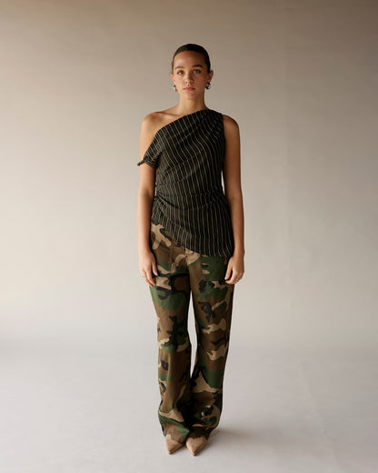 Women's black pinstripe one-shoulder ruched top paired with camo wide-leg pants