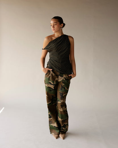 Black striped one-shoulder ruched top paired with camo wide-leg pants on model