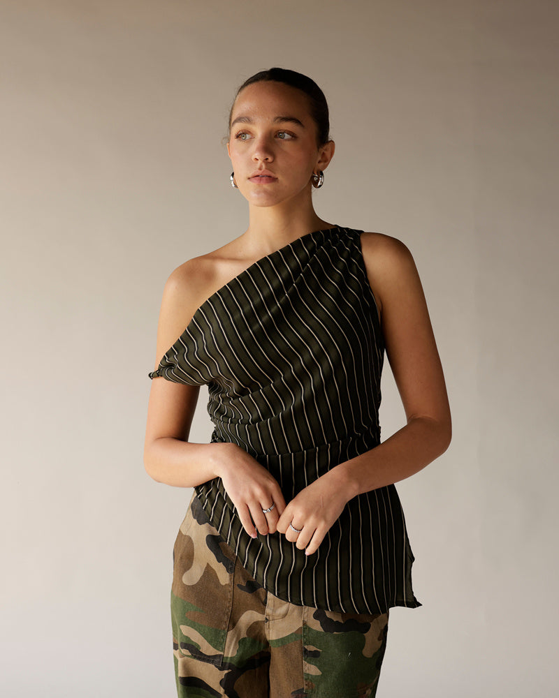 Women's black pinstripe one-shoulder smocked top paired with camo pants