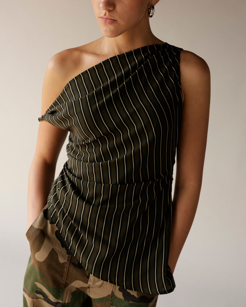 Dark green pinstripe one-shoulder ruched top paired with camo pants