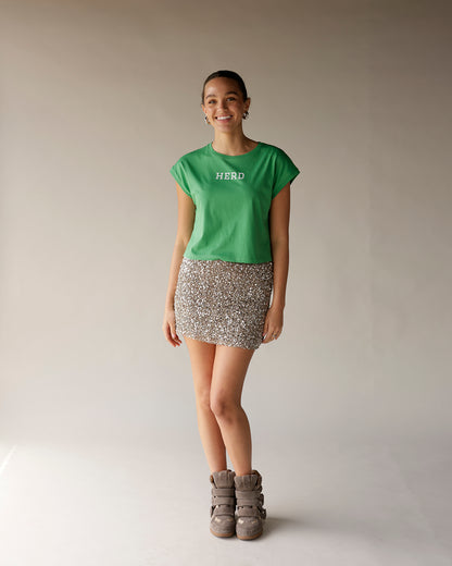 Kelly green cropped muscle tee with white HERD text on chest