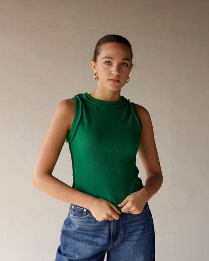 Green ribbed sleeveless mock neck tank top with ruffle shoulder detail