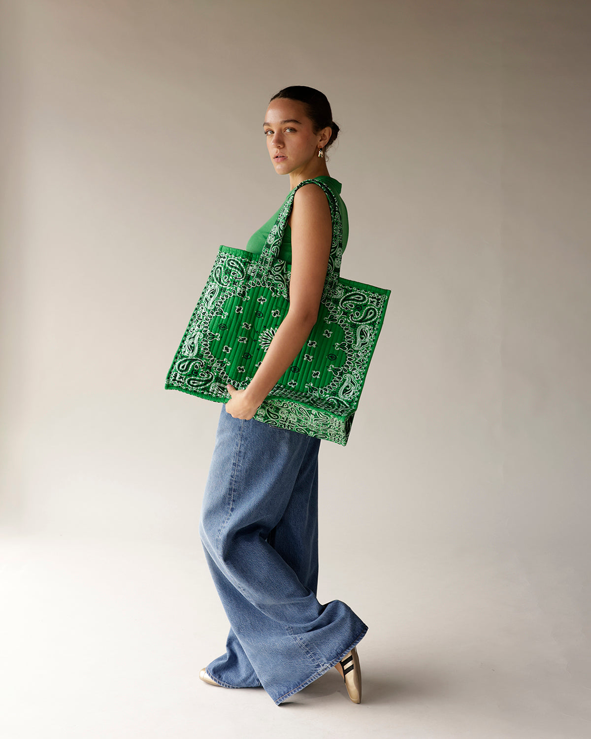 Kelly green paisley bandana print tote bag with pleated texture, large structured silhouette