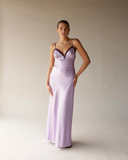 Lilac satin midi slip dress with dark lace trim neckline and thin straps