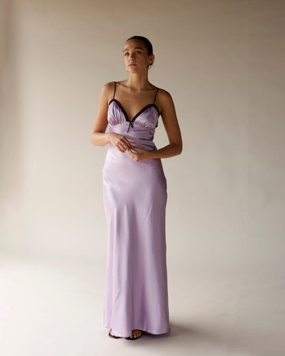 Lilac satin midi slip dress with dark trim, sweetheart neckline, and thin straps